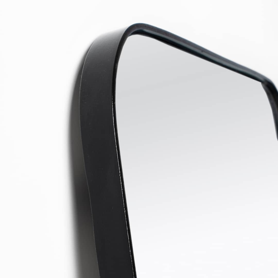 Rounded edge frame in black of a full length Mirror