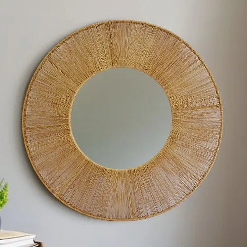 JoJo Round Mirror in Jute Frame Natural  on a wall